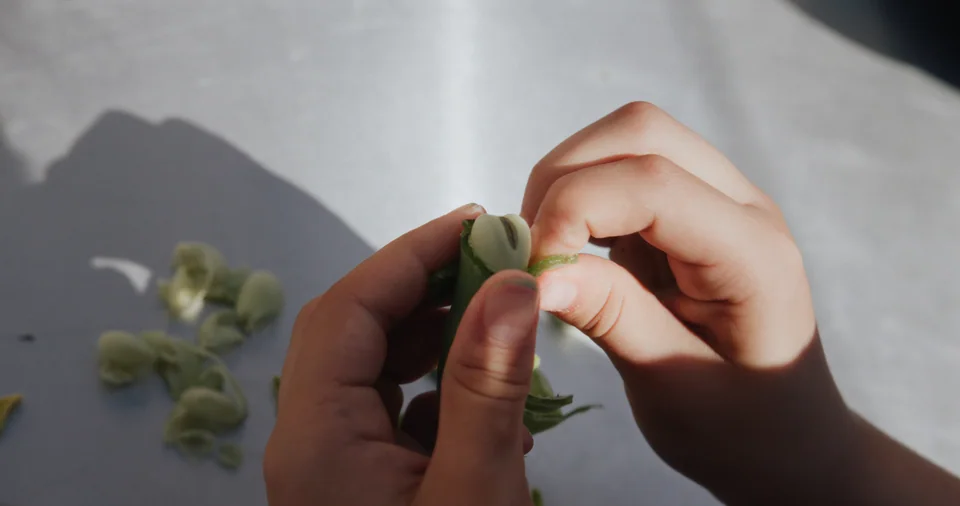 This is a photo of a person's hand holding a sprig of something green and leafy while it is being prepared. The photo has a split-screen effect with two diff…