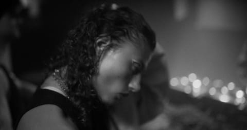 Young woman in techno club at night.