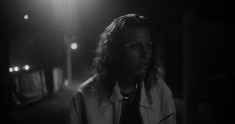 Woman in a techno club at night.