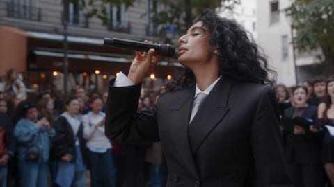 Person singing into microphone