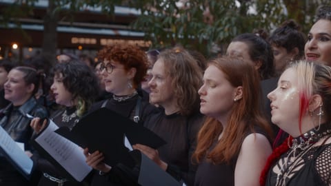 Choir members singing.