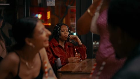 Man talking on phone at table.