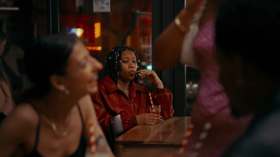 Man talking on phone at table.