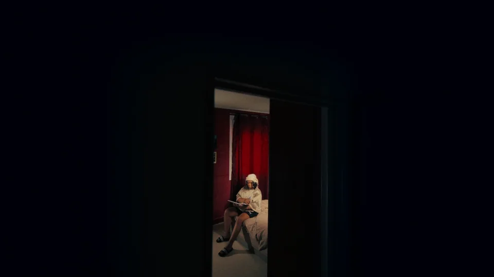 Movie scene in dark room with one person